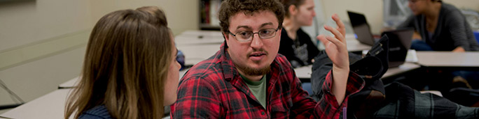 Students talking to each other in a classroom