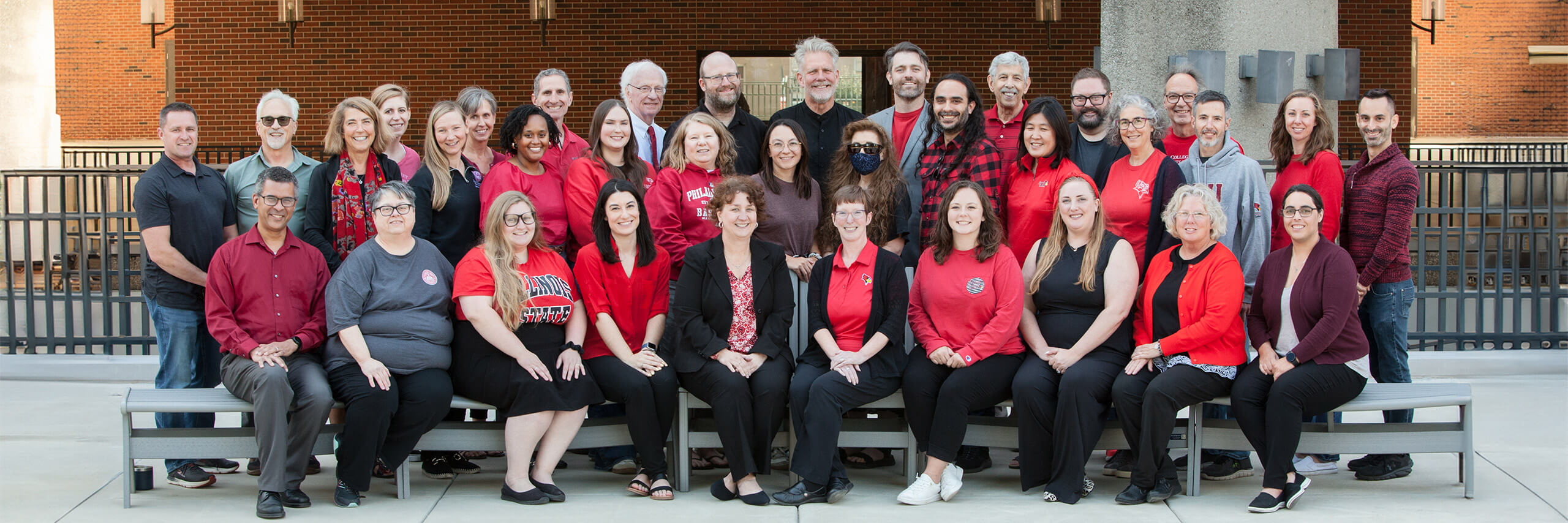 Faculty and Staff posing at the University Campus Quad
