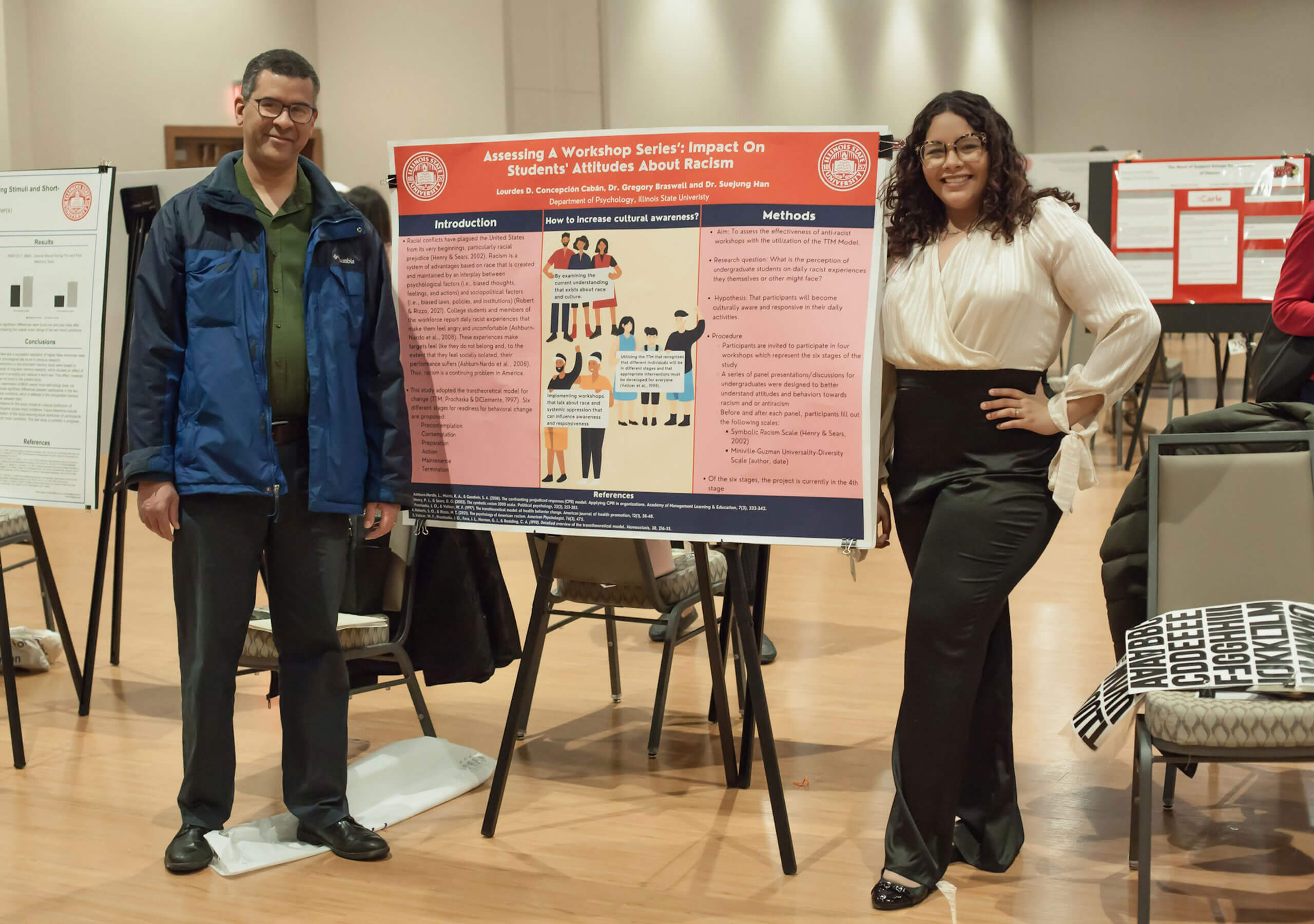 A student and teacher showing their poster.